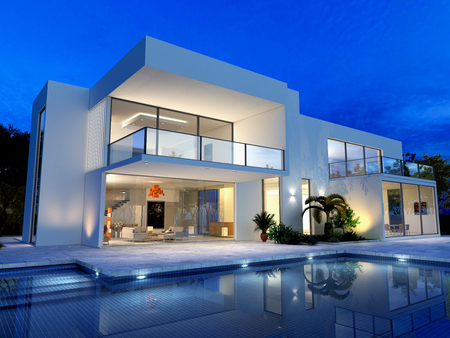 luxurious villa with swimming pool at duskの写真素材