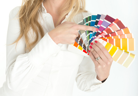 Unknown woman displaying a color swatch samplerの写真素材