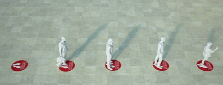 3D rendering of people standing in a queue with social distancing floor markers
