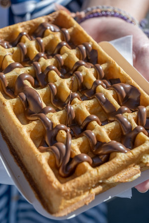 A delicious waffle with hazelnut chocolate creamの写真素材