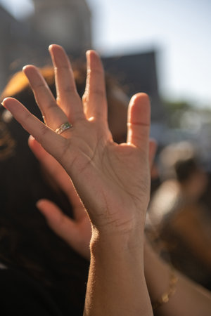 graceful raised female hand with ring