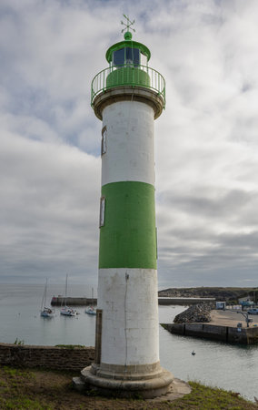 Picturesque harbor of Doelan with beautiful cottages and lighthouseの写真素材
