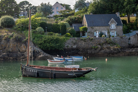 Picturesque harbor of Doelan with beautiful cottages and lighthouseの写真素材