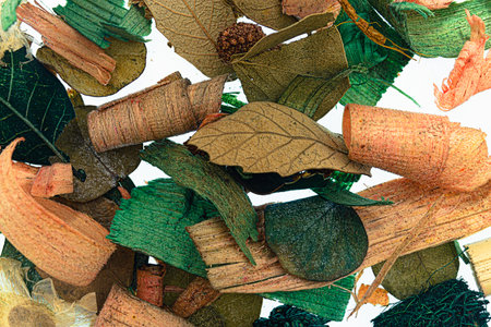 Close-up of dried leaves of natural potpourri with white backgroundの写真素材