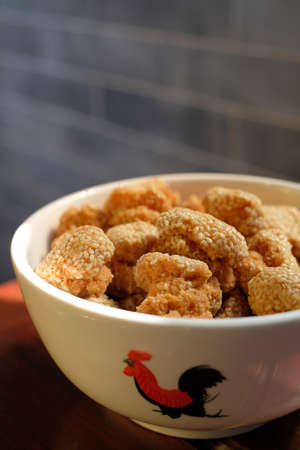A bowl of Chinese sesame cookies. It is a traditional Chinese New Year festival snack in Guangdong...