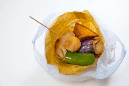 Some Hong Kong street deep-fried snack in a take-away plastic bag