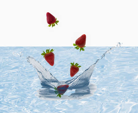 strawberries fall with water splash backgroundの写真素材