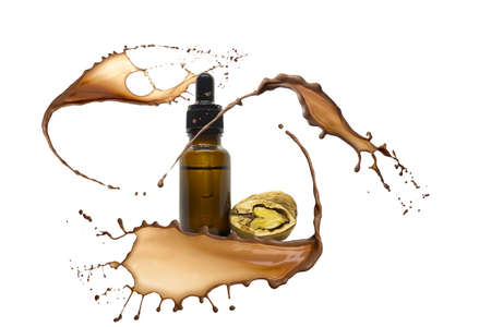 Liquid chocolate nuts and bottle with dropperの写真素材
