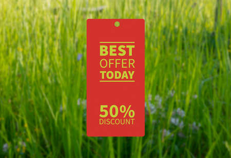 red Today's best offer: 50 percent discount with blurred grass field background