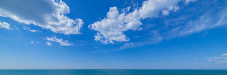 Beautiful panoramic seascape with clouds on a sunny day, mediterranean sea in tuscanyの写真素材
