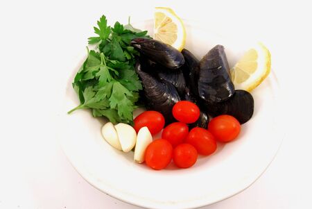 Lemon, mussels and tomatoesの写真素材