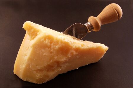 Parmesan cheese on a black backgroundの写真素材