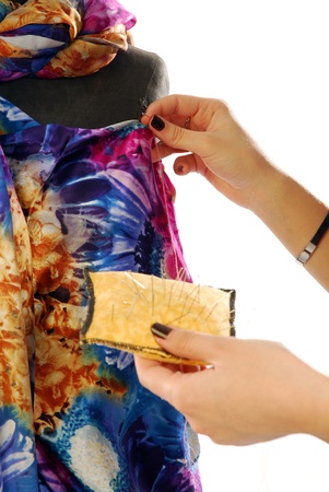 A seamstress  prepares a dress high fashionの写真素材