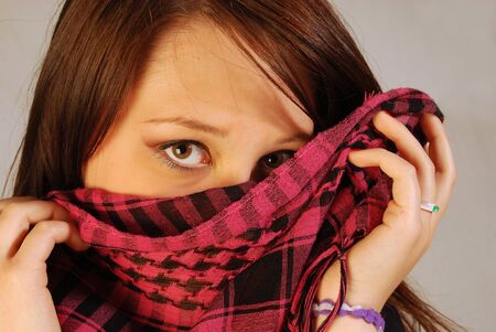 Girl cover her face with scarfの写真素材