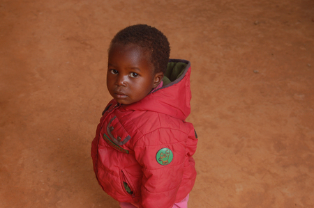 The look of Africa on the faces of children  - Village Pomerini - Tanzania - August 2013 -The intensity of the look of the African children of the Village Pomerini  in Tanzania - Between poverty and disease our help is the only hope for the futureのeditorial素材