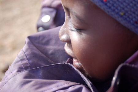Africa -Tanzania - Village Pomerini - august 2013 - The Franciscan Mission for Humanitarian Aid - The look on the faces of the children of Africa, many of them sick with AIDS, a look for the futureのeditorial素材