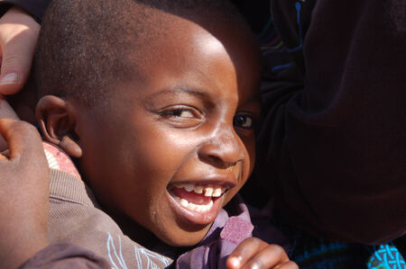 Africa -Tanzania - Village Pomerini - august 2013 - The Franciscan Mission for Humanitarian Aid - The look on the faces of the children of Africa, many of them sick with AIDS, a look for the futureのeditorial素材