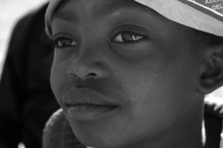 Africa -Tanzania - Village Pomerini - august 2013 - The Franciscan Mission for Humanitarian Aid - The look on the faces of the children of Africa, many of them sick with AIDS, a look for the futureのeditorial素材