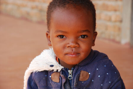 August 2014 - Africa -Tanzania - Moments of everyday life in the Village of Pomerini  affected by AIDS. Between a past of misery and poverty and a future of hope contained in childrenのeditorial素材