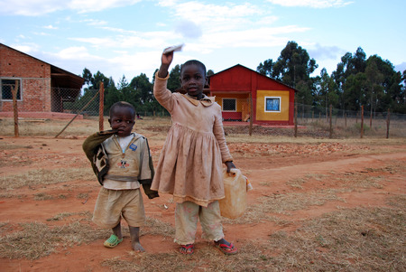 August 2014-Tanzania-Afriva-African children in the Franciscan Mission of the Village of Pomerini hit by the AIDS virus. Between a present of misery, poverty and disease, and a future of hope in their eyes.のeditorial素材