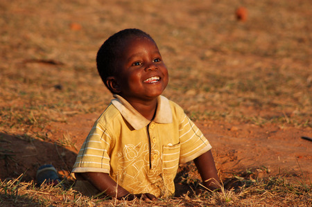 August 2014-Tanzania-Africa-The smile of hope on the faces of African children of the Village of Pomerini affected by the AIDS virus. A smile for a possible future.のeditorial素材