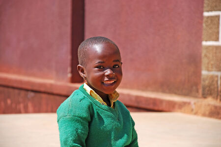 20.08.2014-Village Pomerini-Tanazania-Africa- The smile of a little girl African of asylum in Pomerini, built and managed by the Friars of the Franciscan Mission to give everyone an educationのeditorial素材