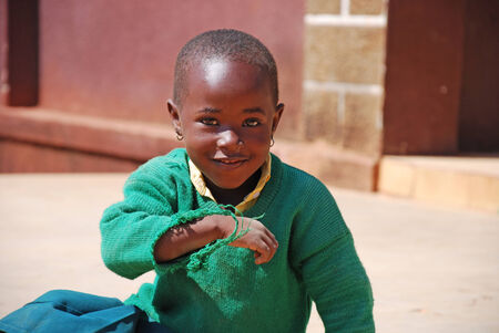 20.08.2014-Village Pomerini-Tanazania-Africa- The smile of a little girl African of asylum in Pomerini, built and managed by the Friars of the Franciscan Mission to give everyone an educationのeditorial素材