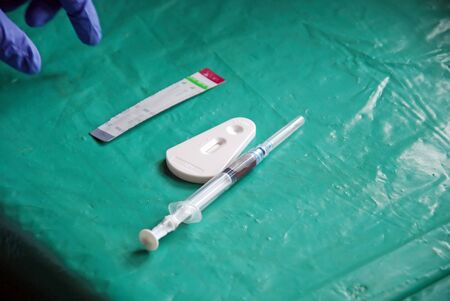 A doctor examines the blood to find out the positive to the AIDS virus