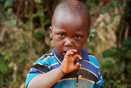August 7, 2014, Mountain Kilolo, Tanzania, Africa - The intense look of an unidentified African child in the mountainous area of Kilolo in Tanzania, where people still live without water, without electricity, in humane conditions appallingのeditorial素材