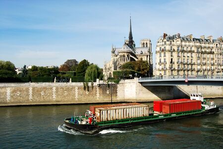 A barge for transporting containers through Paris on the Seineのeditorial素材