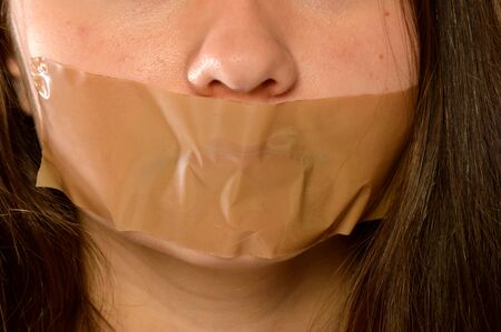 Picture of a woman reduced to silenceの写真素材