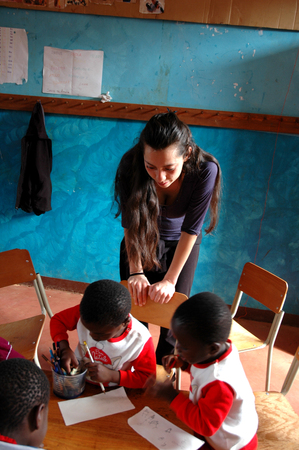 25 October 2017-Franciscan Center of Pomerini-Tanzania-Africa-A group of unidentified African children follow the after-school lessons helped by some unidentified members of a non-profit associationのeditorial素材
