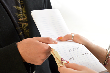 A corrupt professor receives money after correcting a task 2の写真素材