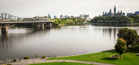 view of the skyline in ottawa canada on its riverの写真素材