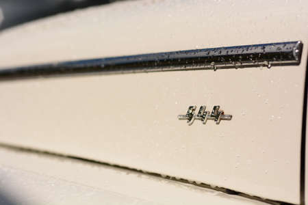 White vintage car hood trim chrome raindropsの写真素材
