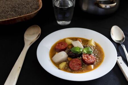 lentil stew with sausage black pudding bacon red and green pepper