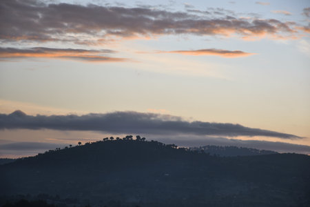 Silhouette of a Hilly town of Maralal, in the clouds at sunrise, Samburu, Kenyaの写真素材