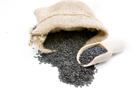 Black sesame in a gunny bag  (seeds)の写真素材