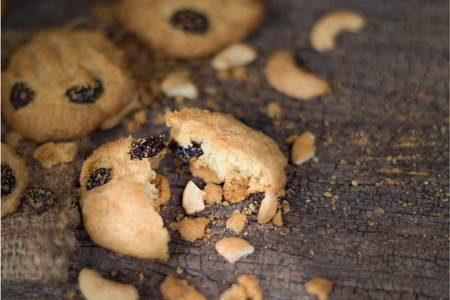 homemade oatmeal cookies with cashew on old Cracked Wood Backgroundの写真素材
