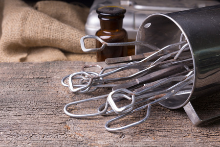 Old medical equipment on old wood backgroundの写真素材