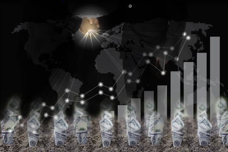 Dollar bill plant growth from ground over  city background. Double exposure. Business finance Partnership  and investment conceptの写真素材