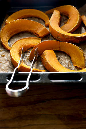 Roasted pumpkin on baking paperの写真素材