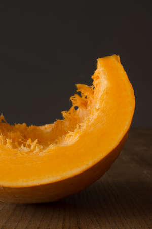 Pumpkin slices on gray backgruondの写真素材