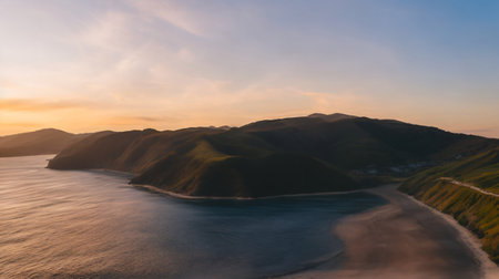 Aerial panoramic view of the Pacific Ocean coastline during sunset.の素材