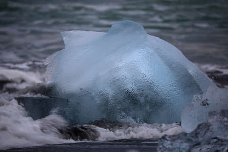 Glacier ice chunks on the black beach at Jokulsarlon, Iceland