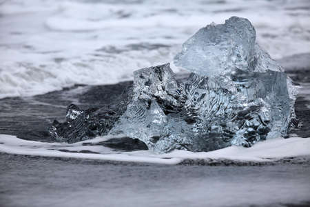 Glacier ice chunks on the black beach at Jokulsarlon, Iceland