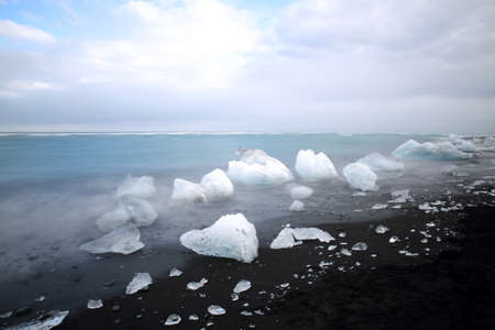 Glacier ice chunks on the black beach at Jokulsarlon, Iceland