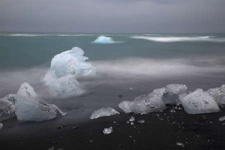 Glacier ice chunks on the black beach at Jokulsarlon, Iceland