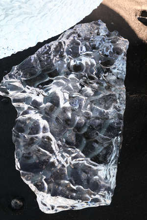 Glacier ice chunks on the black beach at Jokulsarlon, Iceland