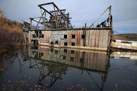 The remains of delelict mining dredge outside of Dawson City,の写真素材